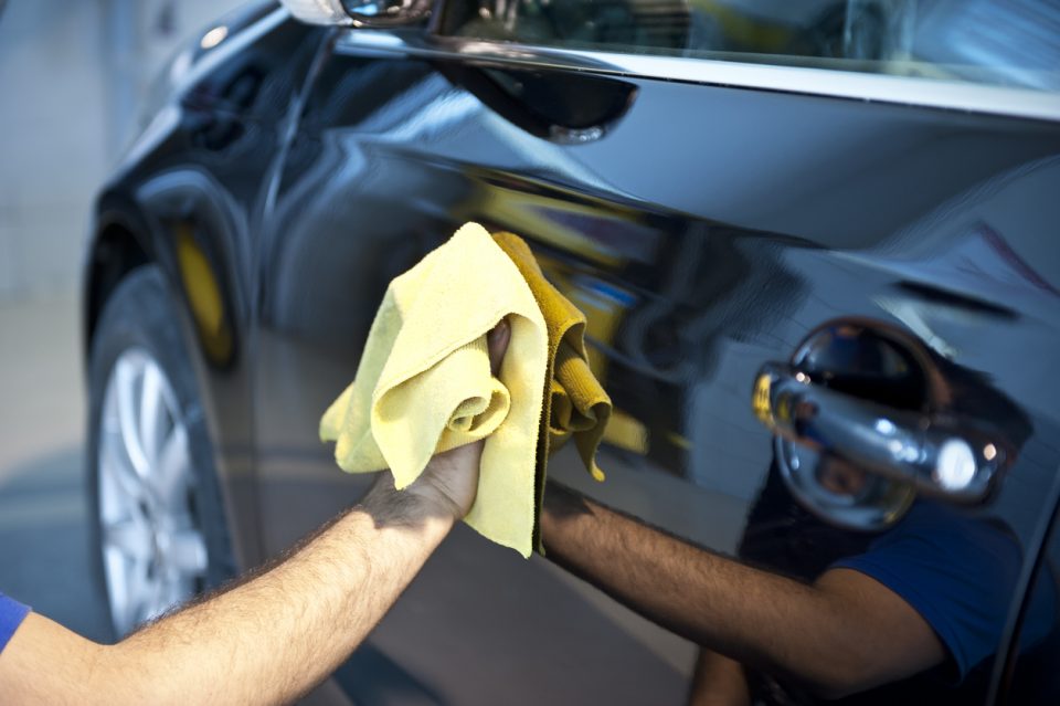 Man waxing his car