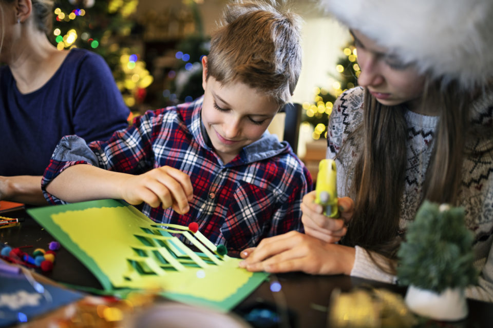 Family making Christmas cards