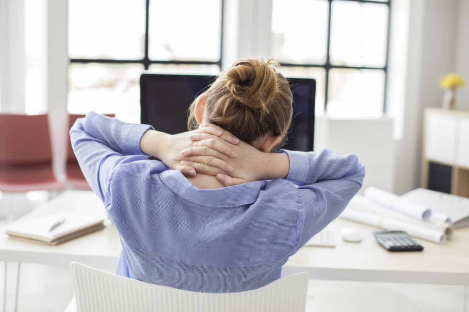 Woman massaging her neck