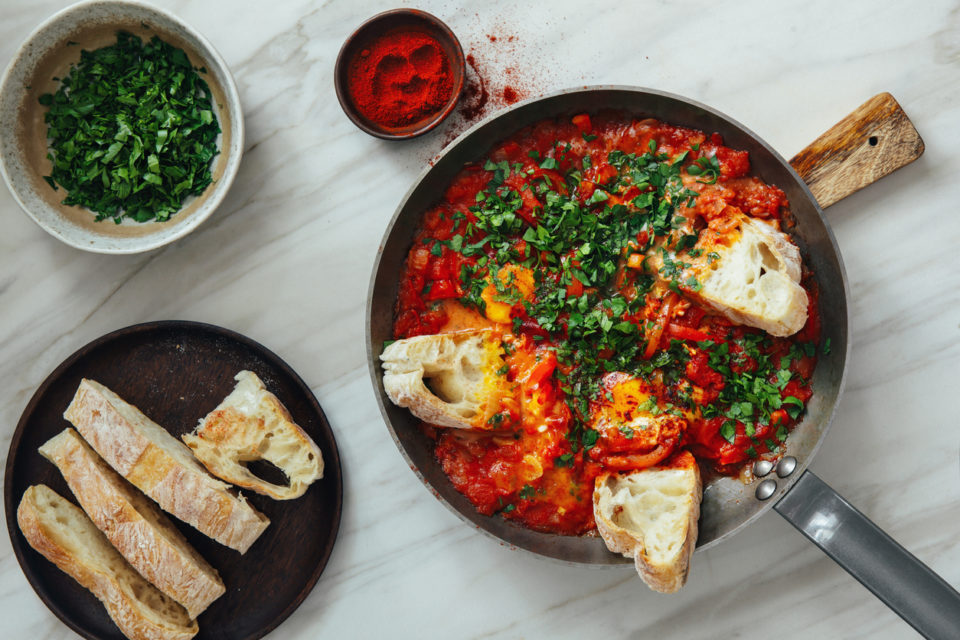 Fresh Shakshouka served in cooking pan