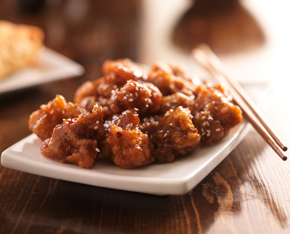 chinese sesame chicken with chopsticks