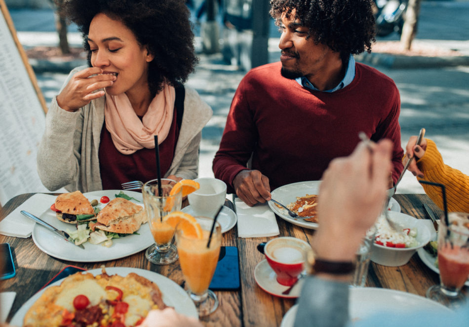 couple enjoying breakfast at an outdoor patio