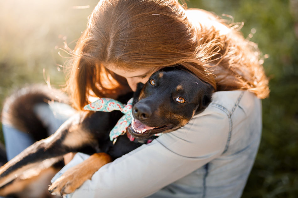 Girl hugging her dog