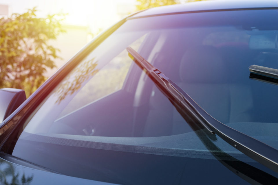 The work of windshield wipers - brushes and an evening sunbeam