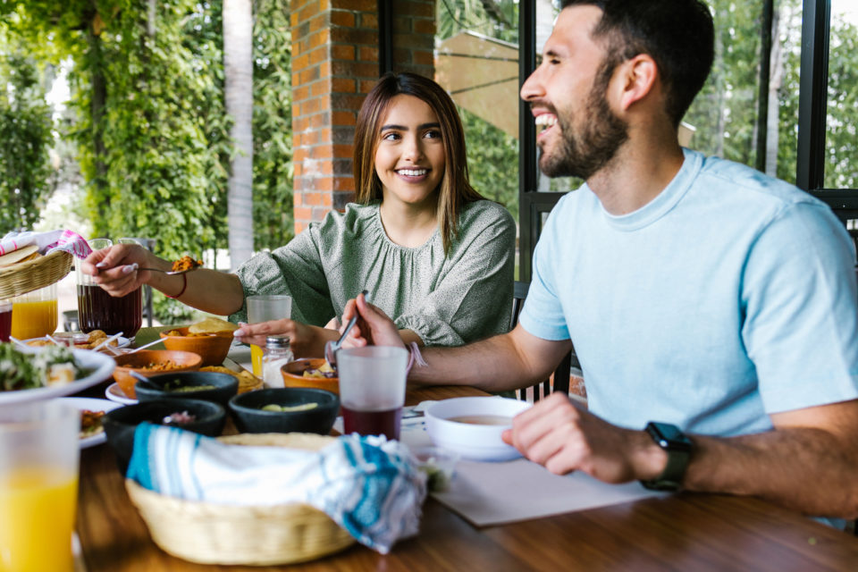 couple eating at restaurant outdoors