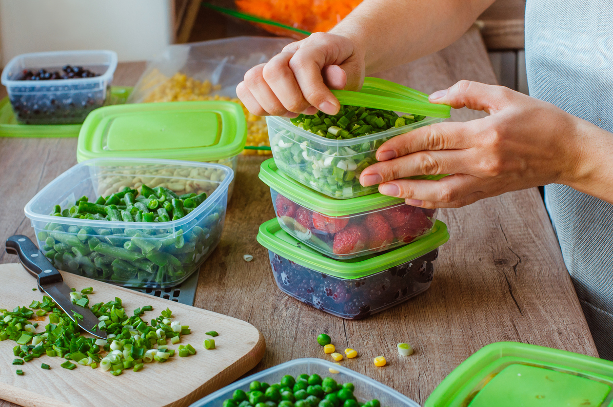 Close up of woman preparing plastic food boxes